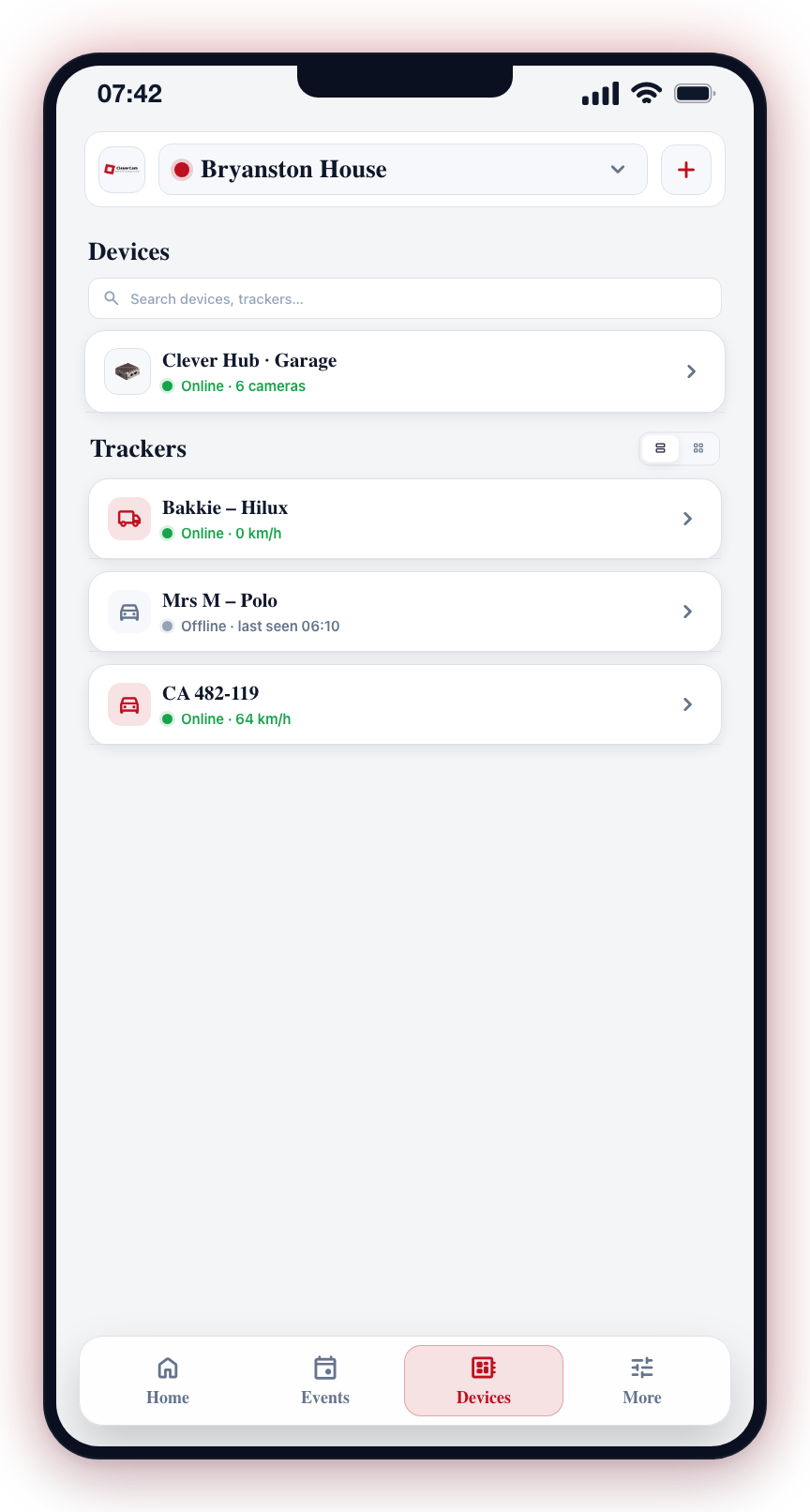 The Trackers section on the Devices tab. The list/grid toggle is in the section header; tap a tracker to open it.