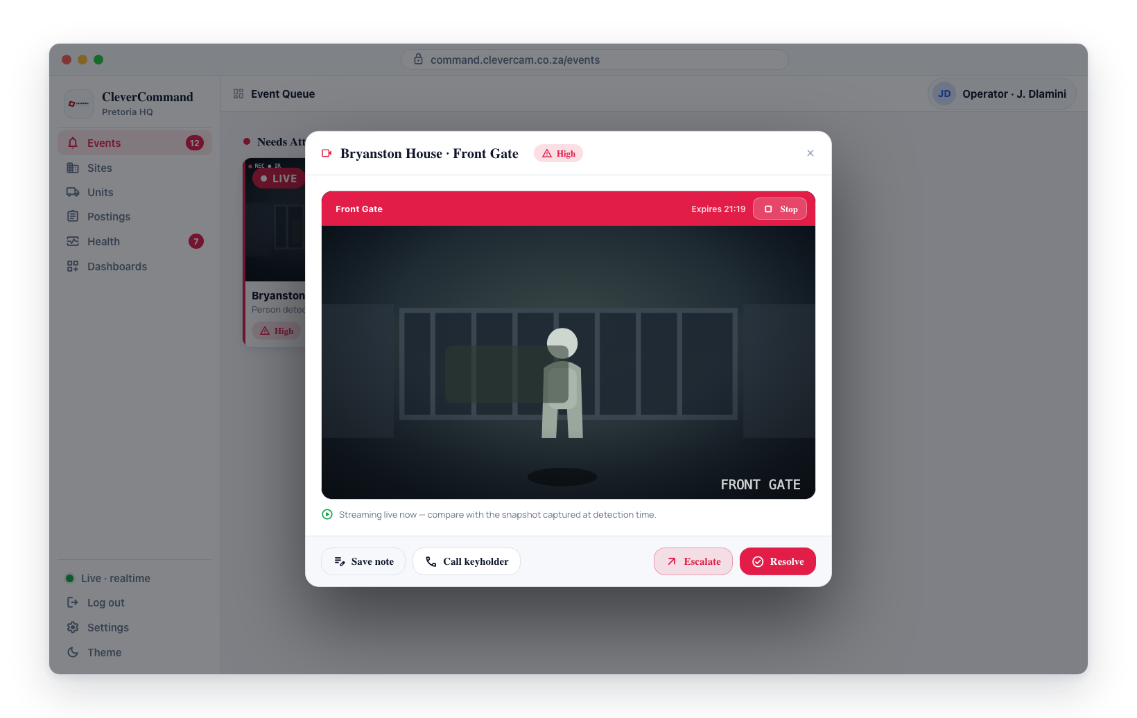 The live stream playing over the snapshot, with the red bar showing the camera name and a Stop button.
