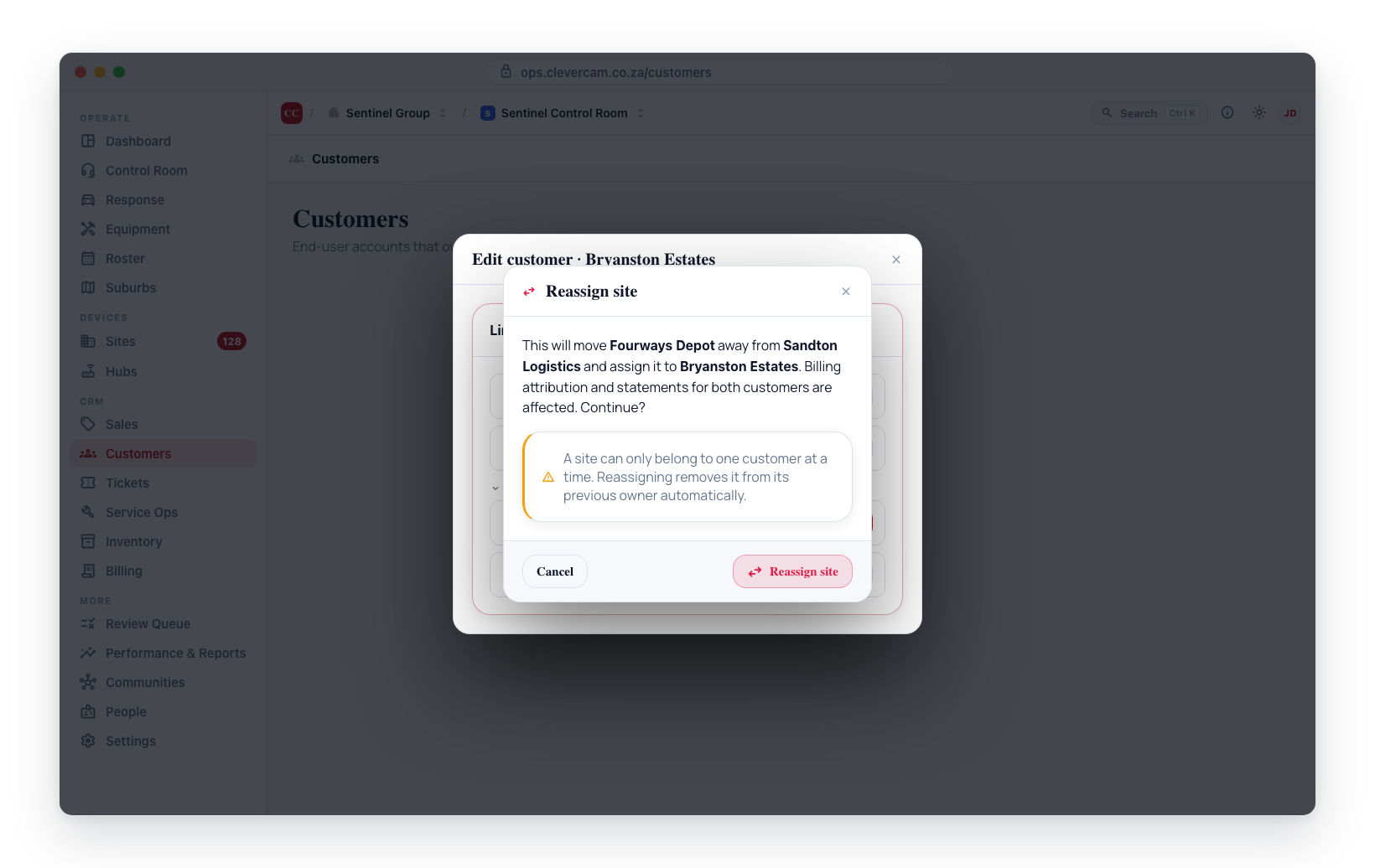 Reassigning a site that another customer owns prompts for confirmation, naming both the current and new owner.