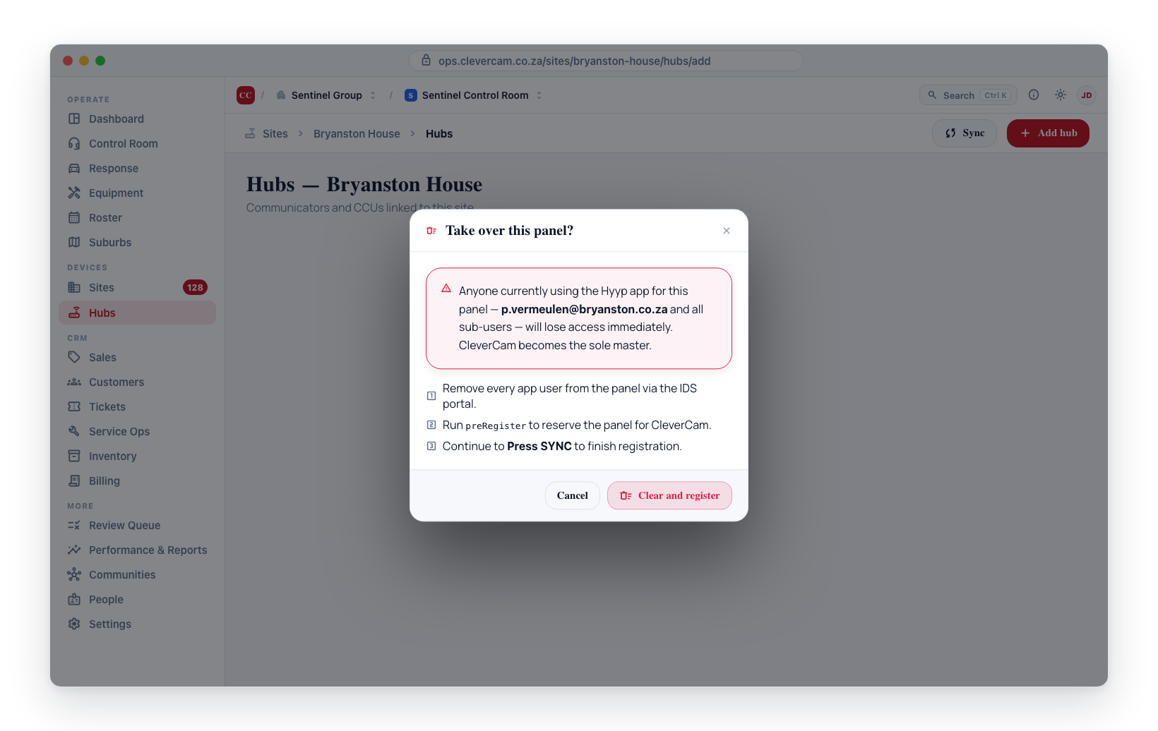 The Take over alarm panel confirm — Clear and register removes every existing app user, then routes to Press SYNC.