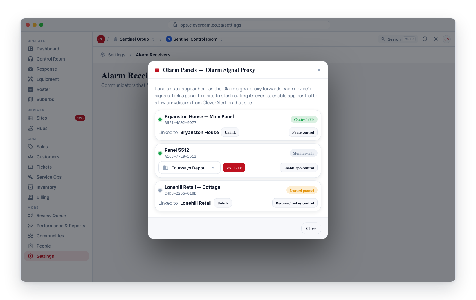 The Olarm Panels manager — each auto-spawned panel shows its device ID, online dot, control badge, and Link / Enable-control actions.